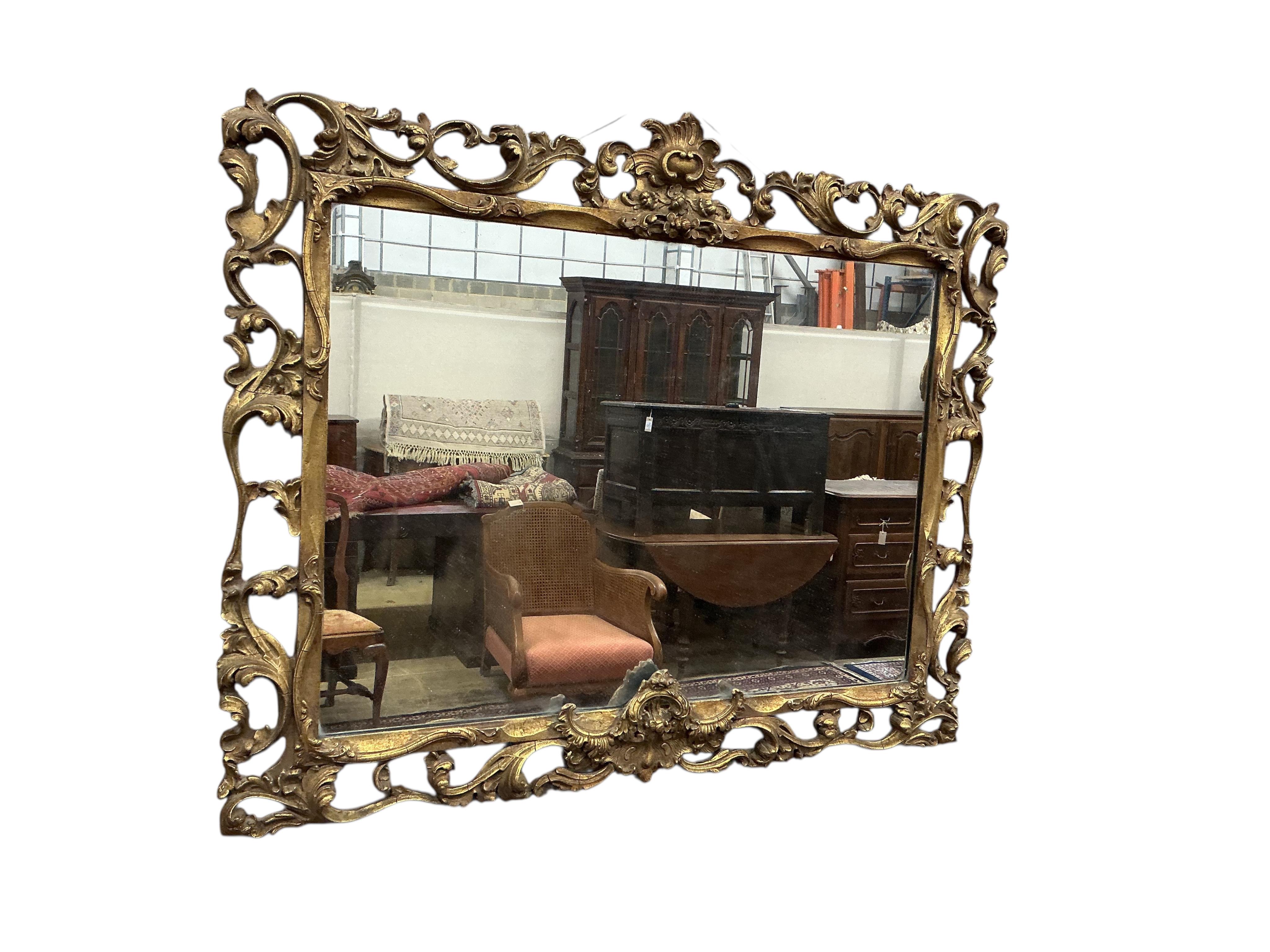 A giltwood mirror with openwork surround, width 88cm, height 70cm